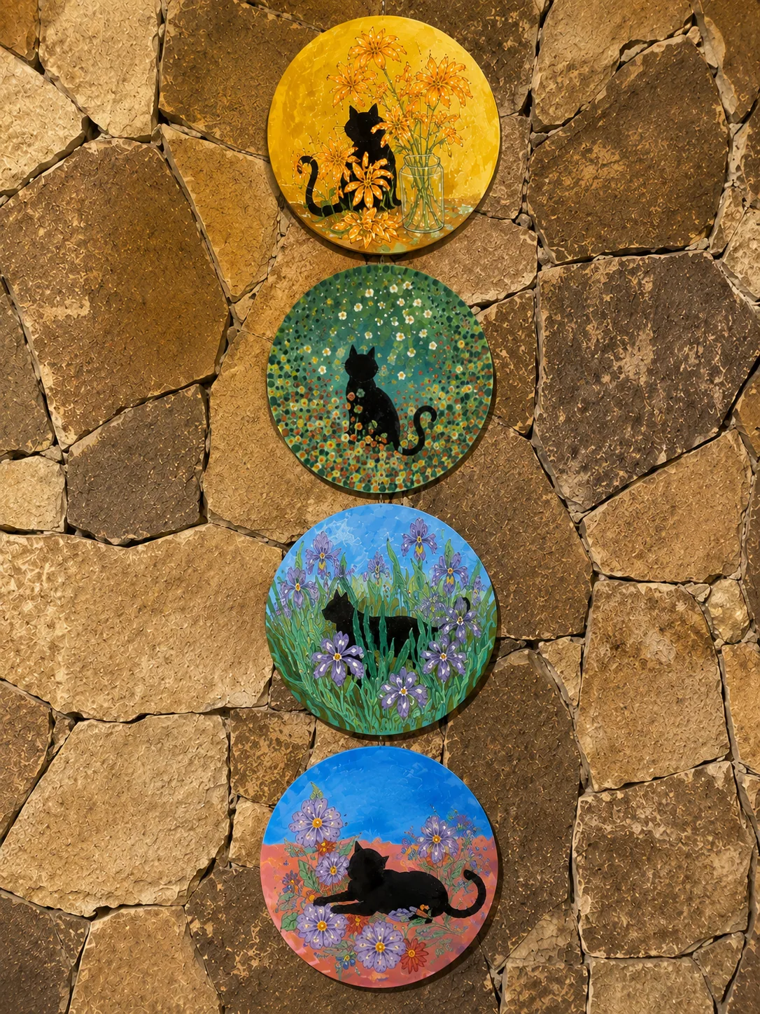 Round cat wall pieces from the Tinto Studio shared archive